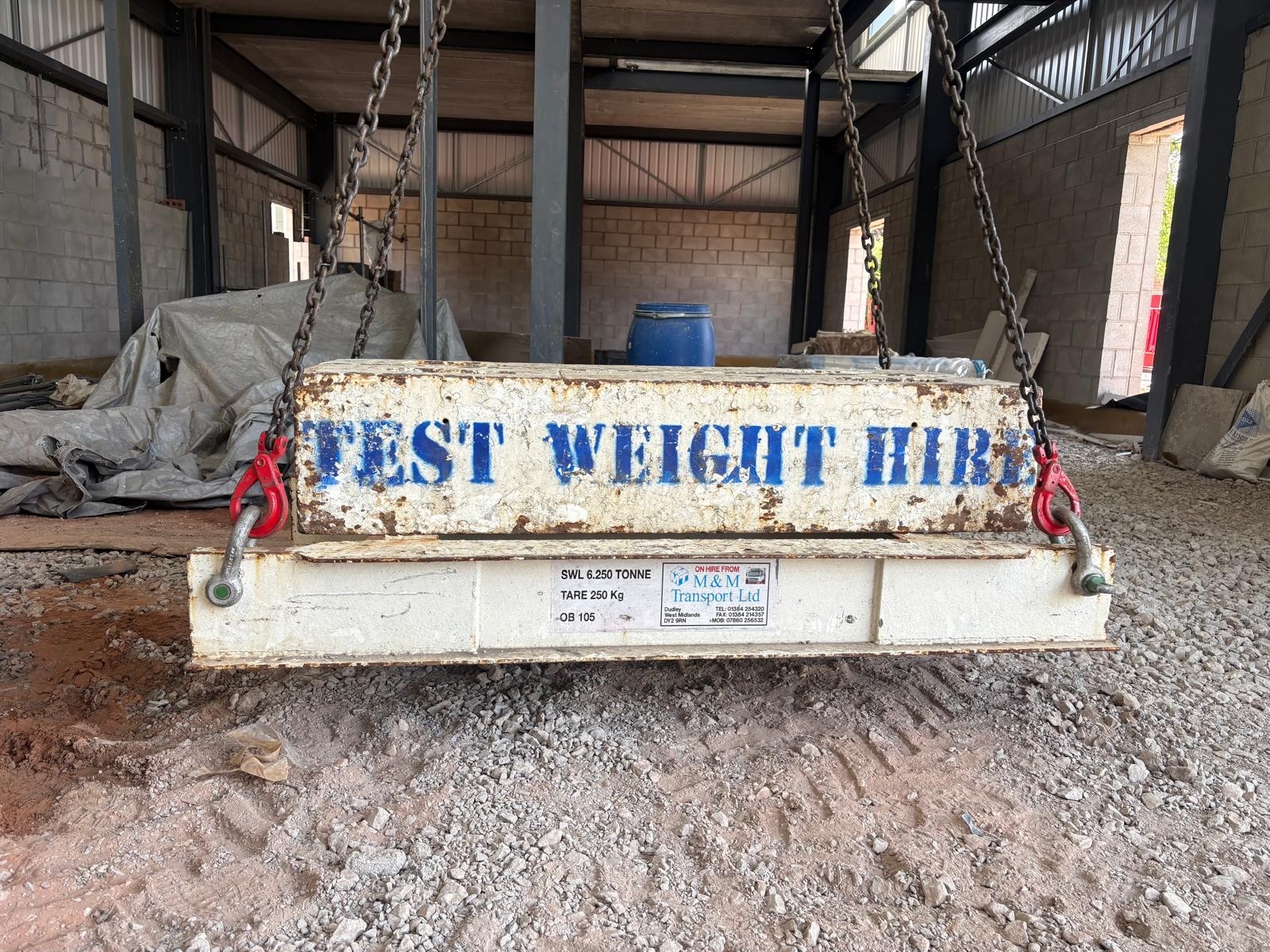 Heavy test weight block used for crane and lifting equipment calibration.